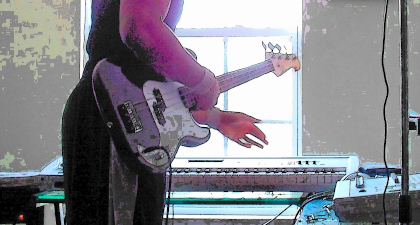 Jacqueem Jt Spratley with a bass